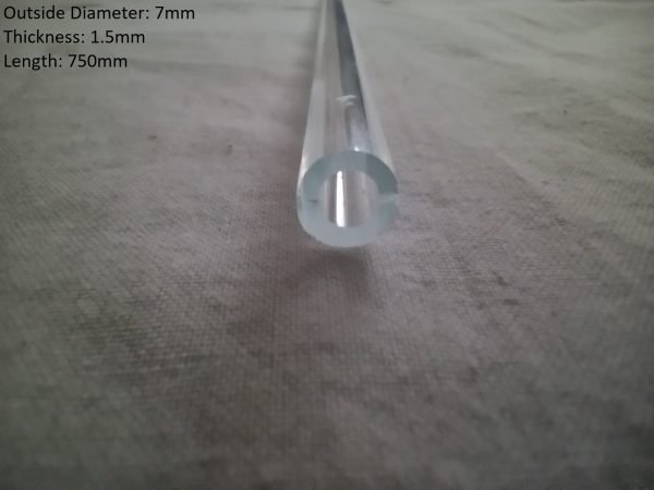 Clear borosilicate glass tube with a 7mm outside diameter and 1.5mm thickness, length of 750mm, resting on a textured surface.